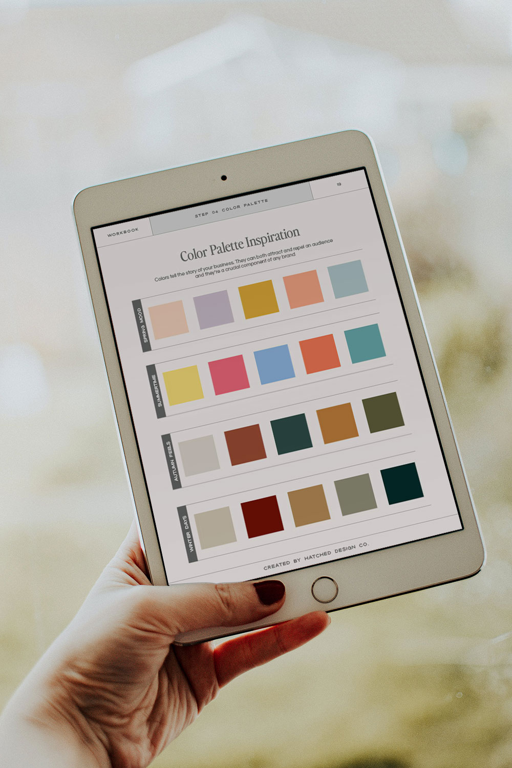 hand holding up ipad with color palettes